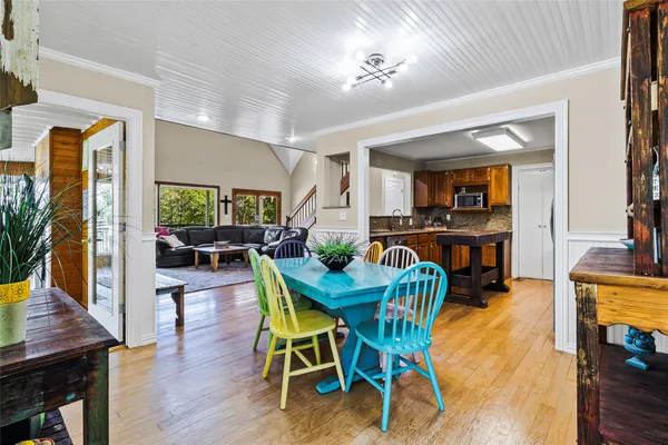 a view of a dining room with furniture and wooden floor