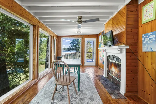 a view of a porch with furniture and a yard