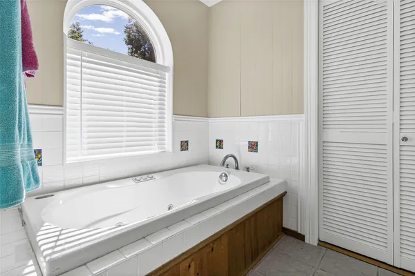 a bathroom with a tub and a sink