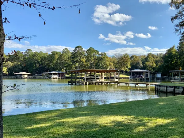 a view of a swimming pool with a table and chairs
