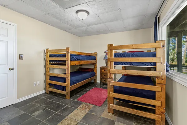 a view of bedroom with furniture and window