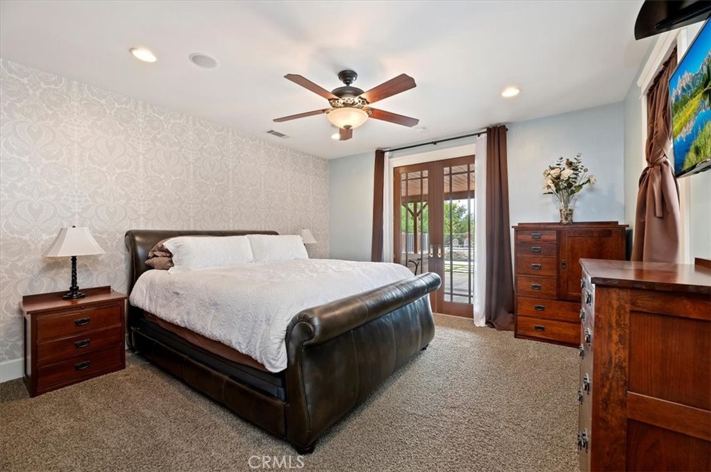 16420 Rocky Glen Road Perris, CA 92570 - Photo 28 of 74 a bedroom with a bed dresser and a window