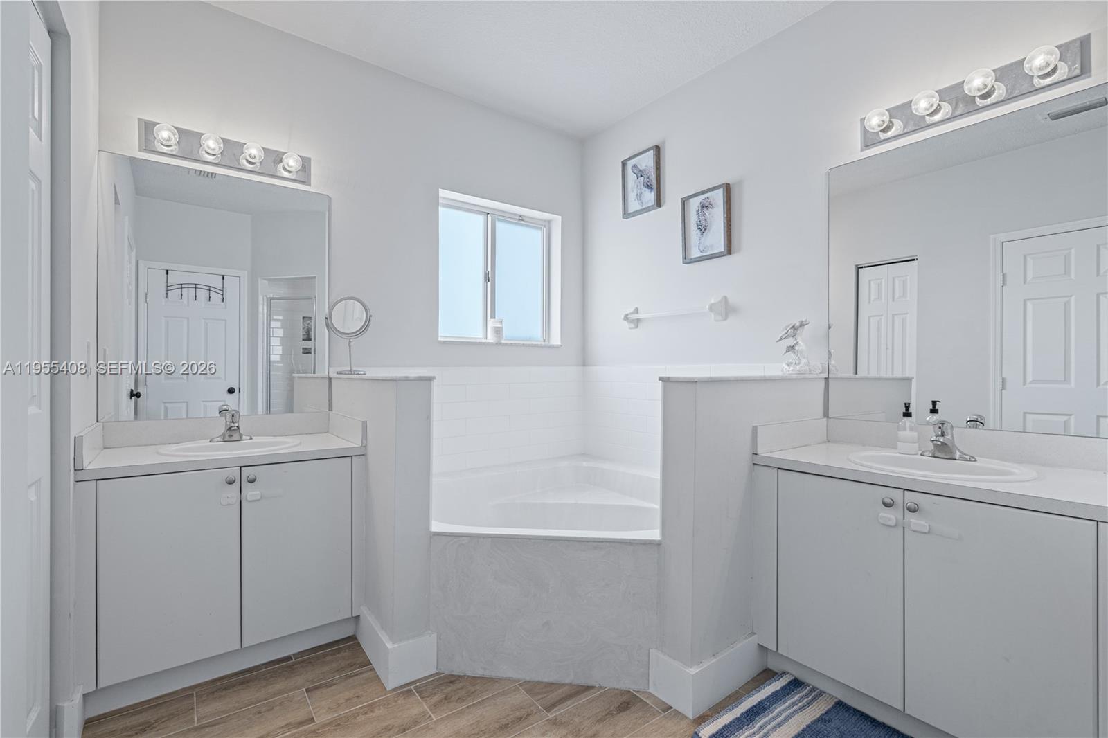 1940 Southeast 24th Terrace Homestead, FL 33035 - Photo 16 of 29 a bathroom with a sink and mirror with toilet