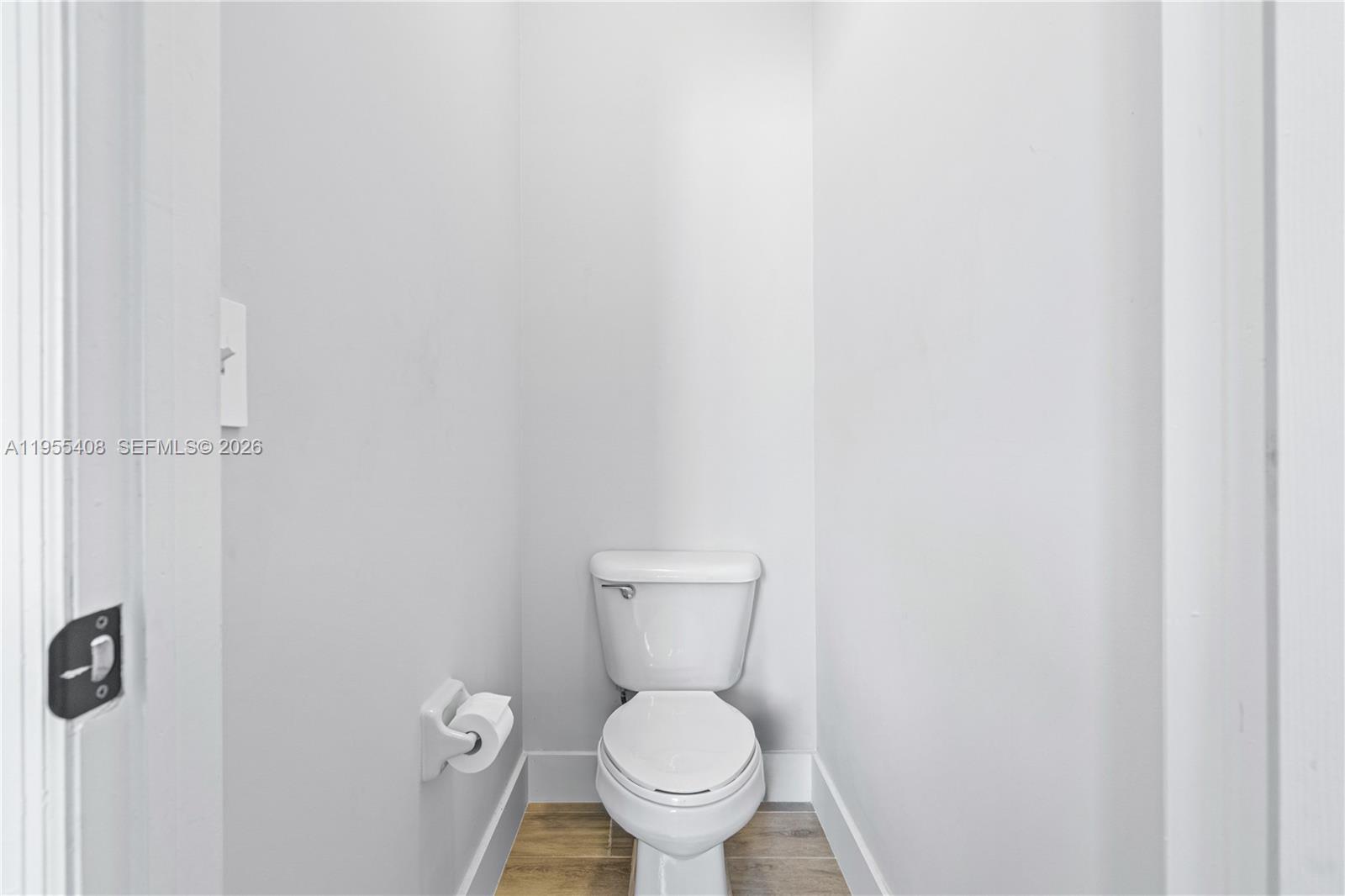 1940 Southeast 24th Terrace Homestead, FL 33035 - Photo 17 of 29 a white toilet sitting next to a white wall