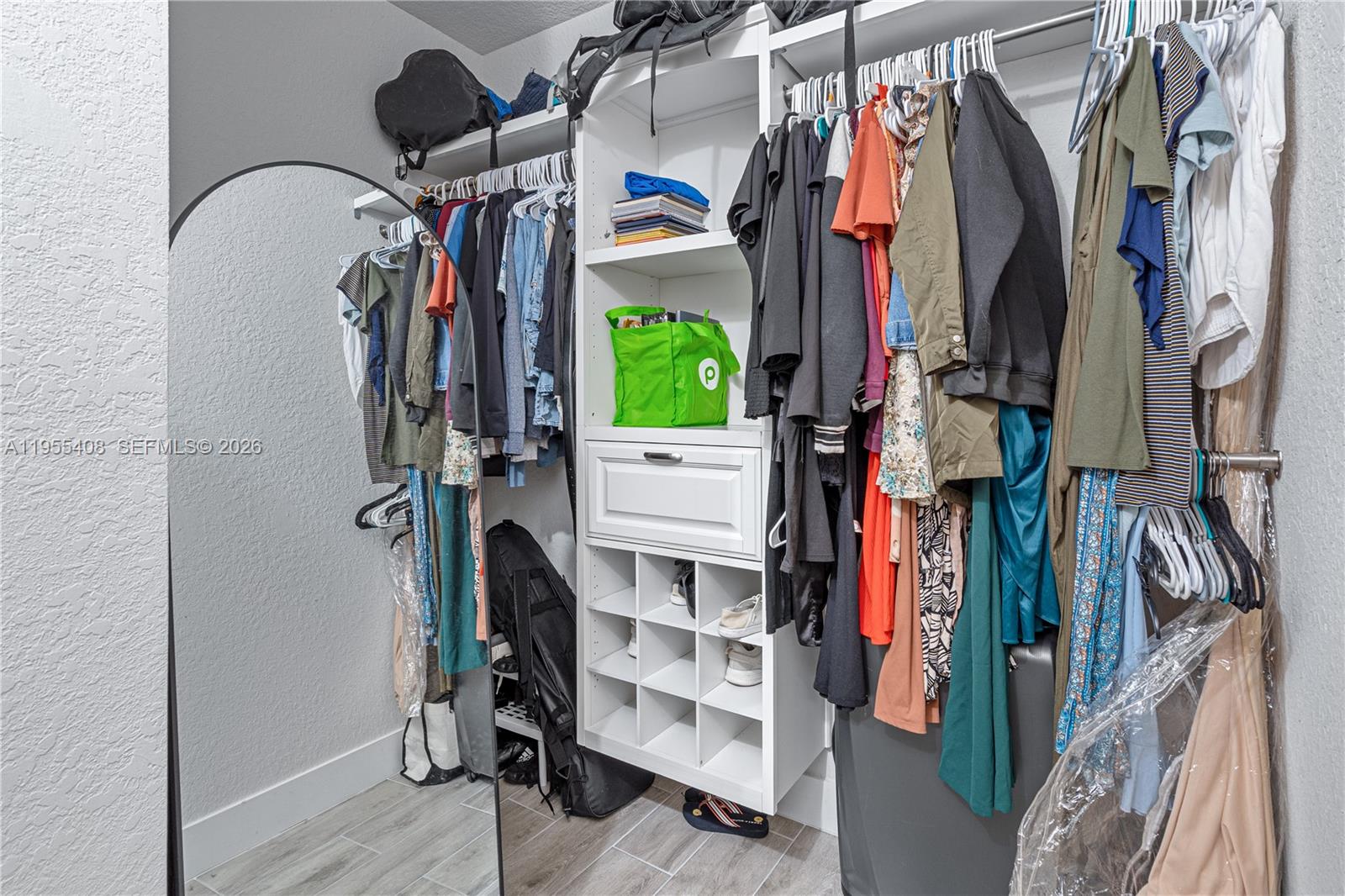1940 Southeast 24th Terrace Homestead, FL 33035 - Photo 18 of 29 a view of walk in closet with clothes and shoes