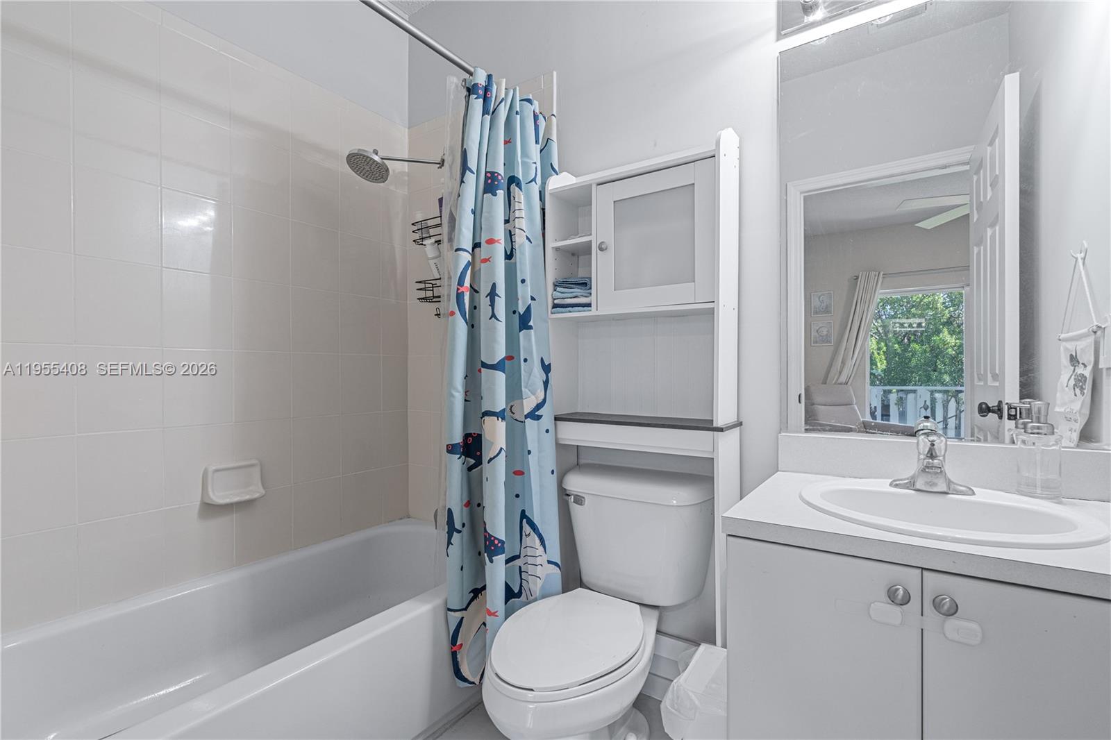 1940 Southeast 24th Terrace Homestead, FL 33035 - Photo 21 of 29 a bathroom with a sink toilet and shower