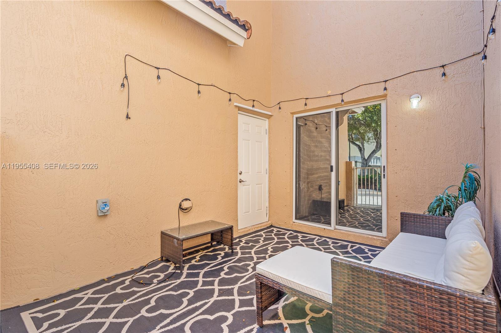 1940 Southeast 24th Terrace Homestead, FL 33035 - Photo 23 of 29 a living room with a couch and a table
