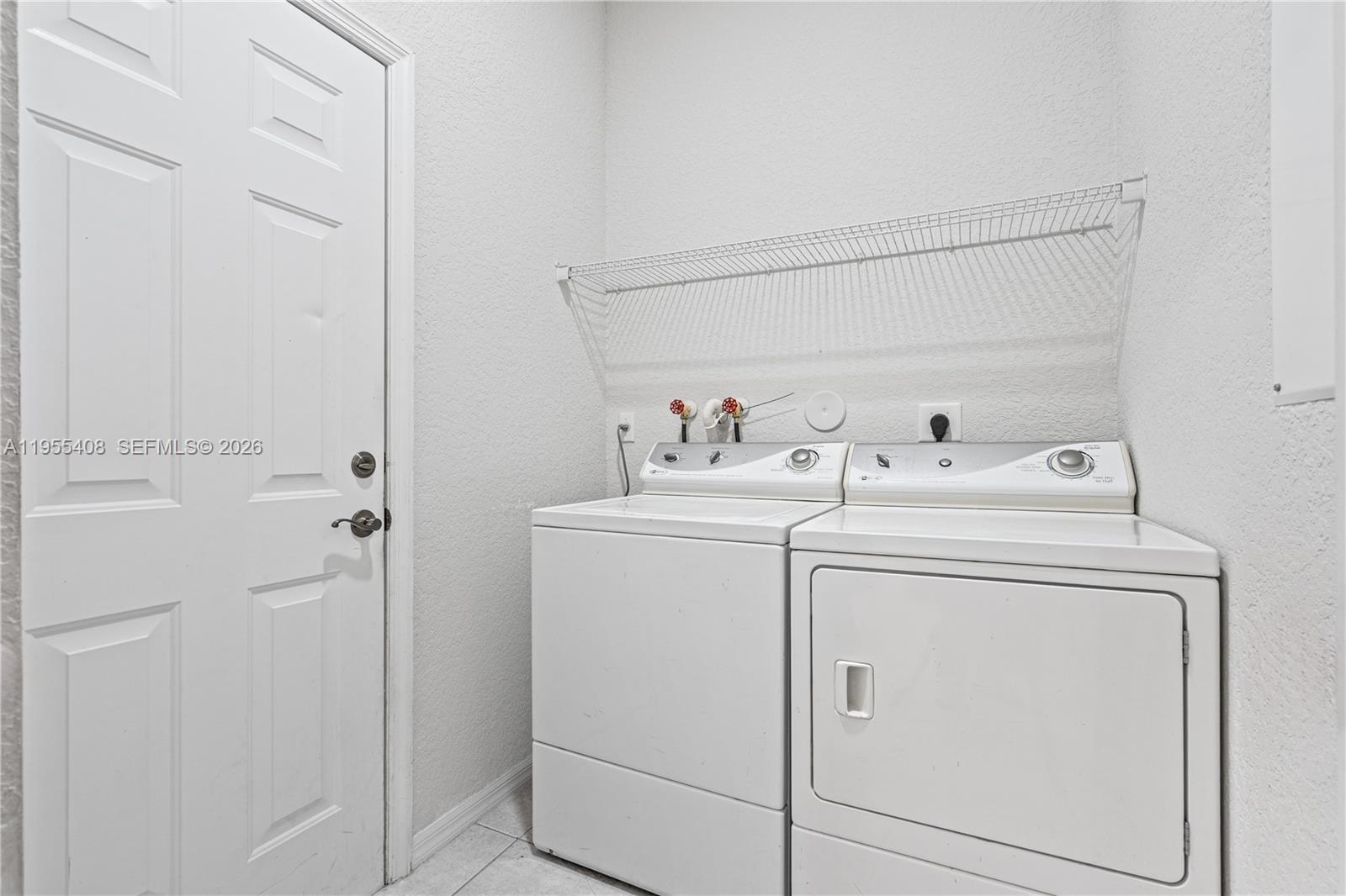 1940 Southeast 24th Terrace Homestead, FL 33035 - Photo 25 of 29 a utility room with dryer and washer