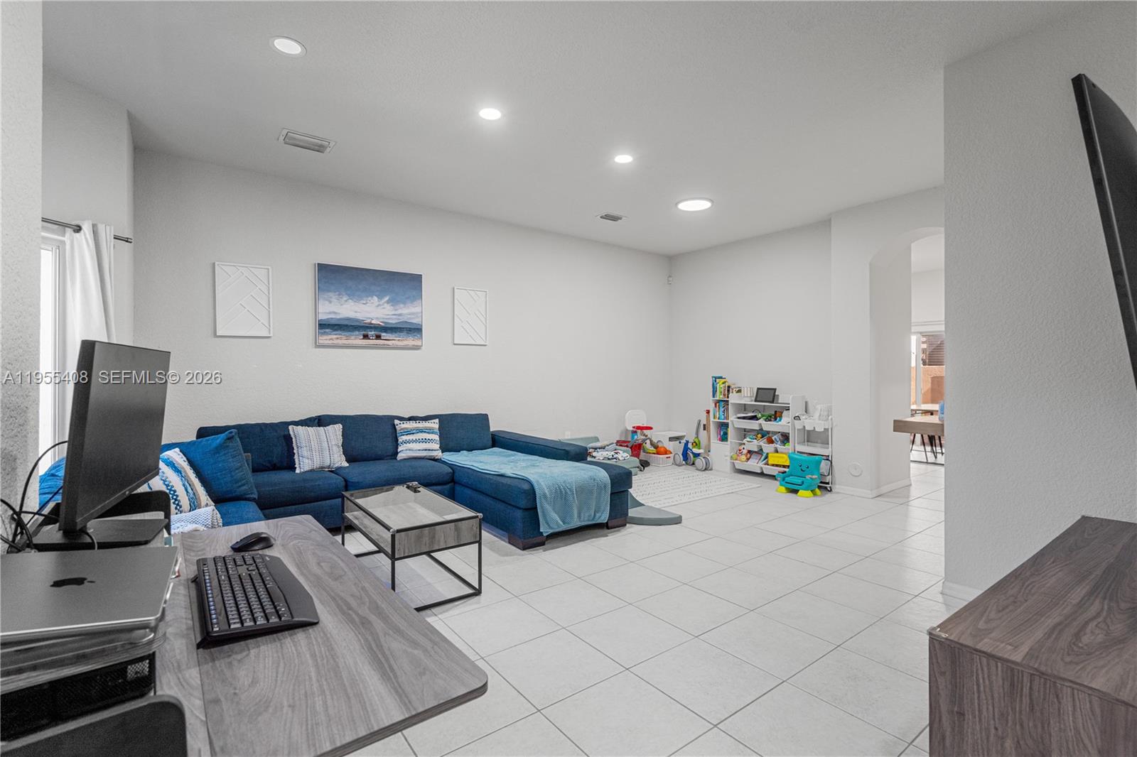 1940 Southeast 24th Terrace Homestead, FL 33035 - Photo 6 of 29 a living room with furniture and a flat screen tv