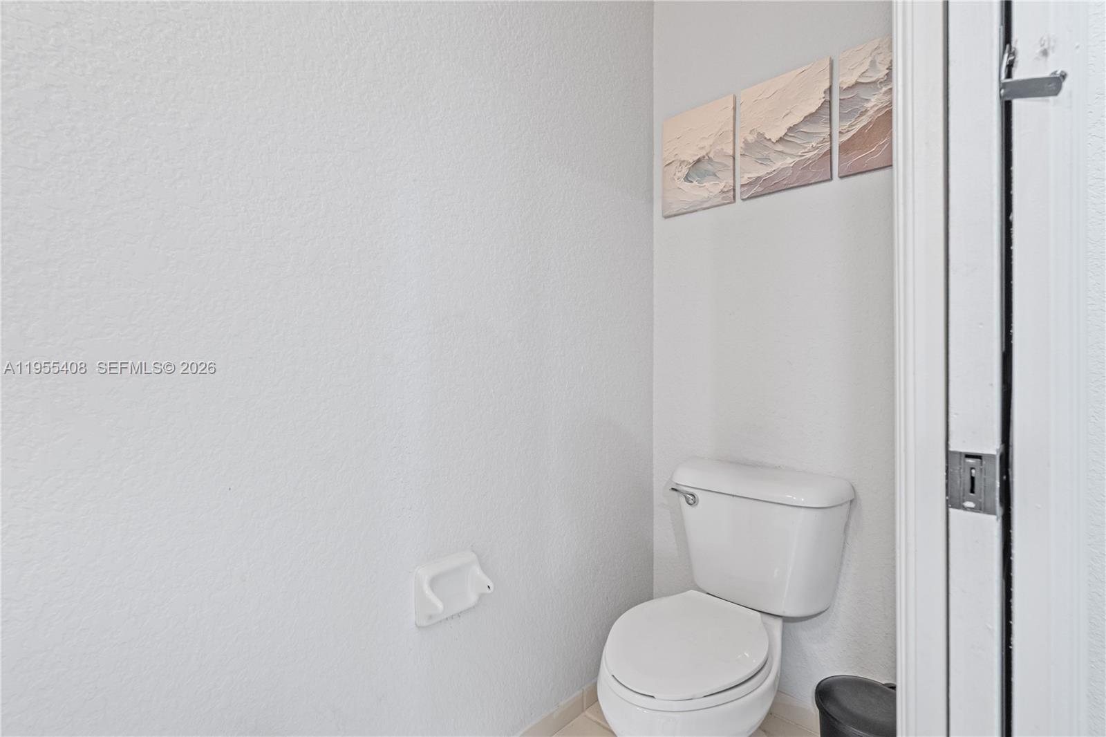 1940 Southeast 24th Terrace Homestead, FL 33035 - Photo 8 of 29 a white toilet sitting next to a shower