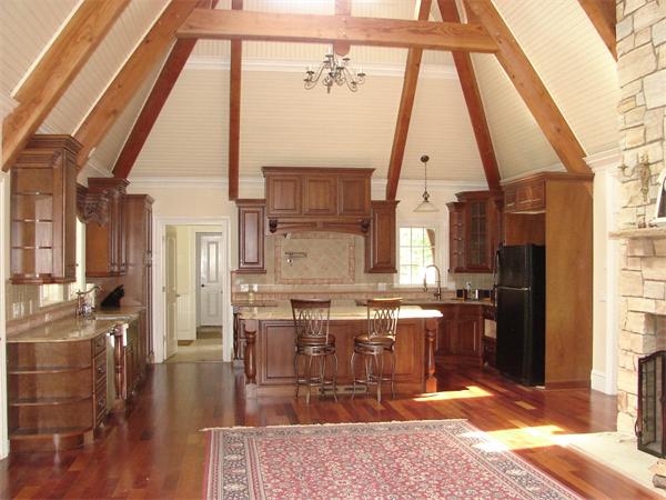 95 Fox Run Road Bolton, MA 01740 - Photo 3 of 25 a kitchen with stainless steel appliances kitchen island granite countertop a refrigerator a stove and a sink with cabinets