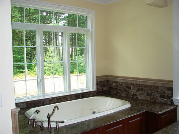 95 Fox Run Road Bolton, MA 01740 - Photo 10 of 25 a bathroom with a bathtub and window