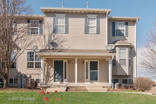 front view of a house with a yard