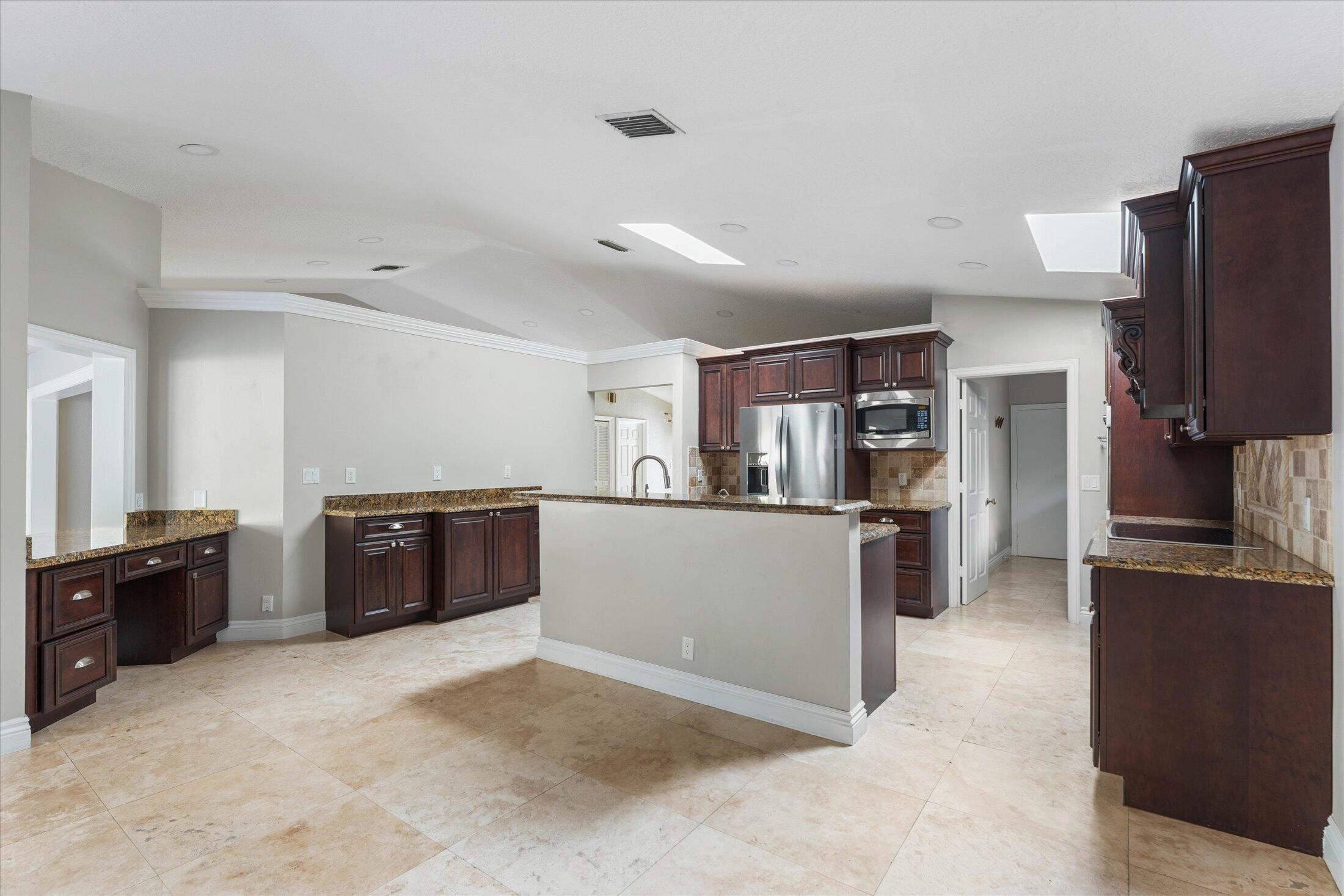 1598 Southwest 5th Avenue Boca Raton, FL 33432 - Photo 12 of 36 Kitchen with Desk and Bar Area