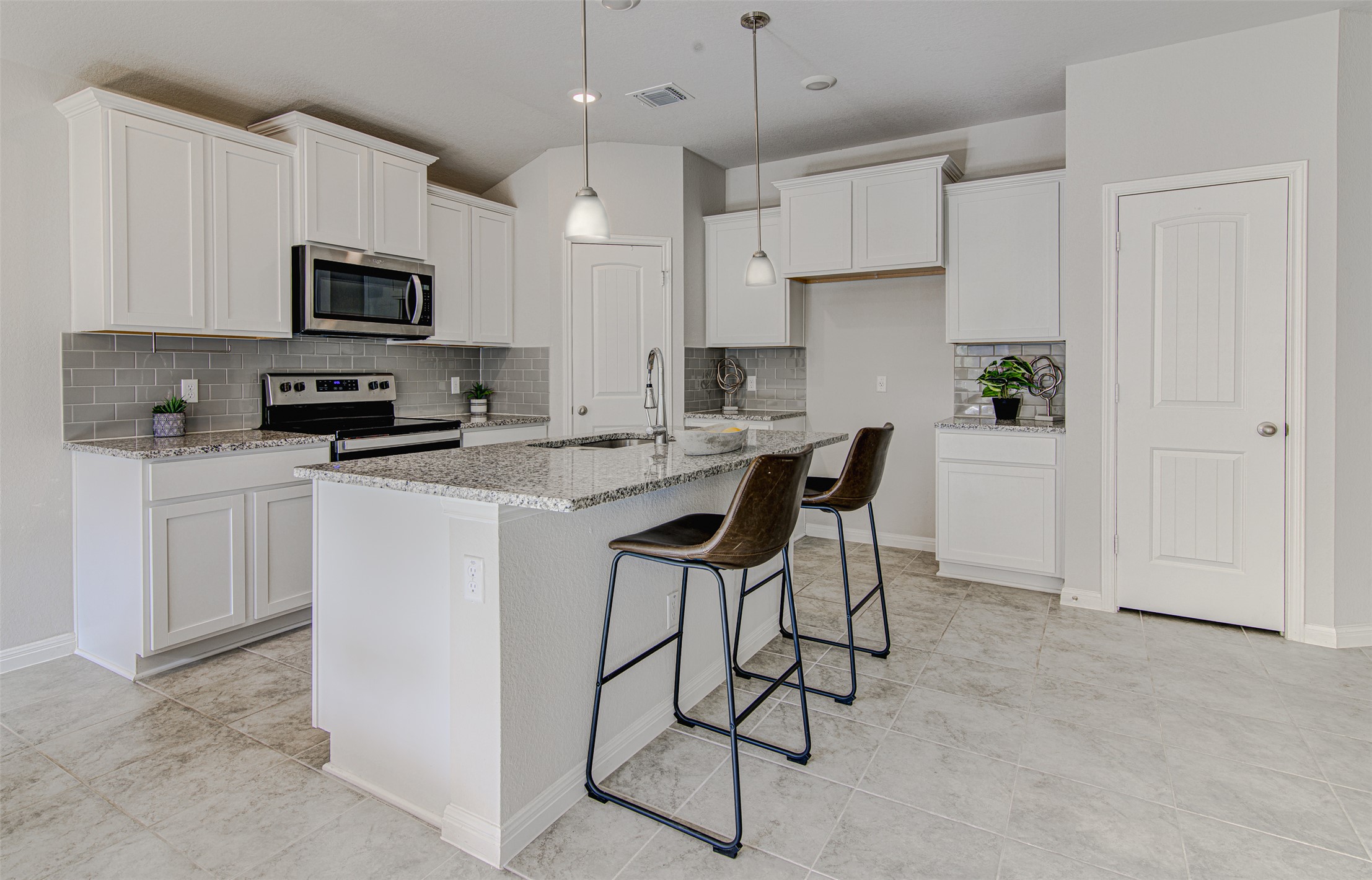 316 Pepper Mill Loop Burnet, TX 78611 - Photo 11 of 27 Culinary delights await in this bright kitchen with granite countertops and modern appliances.