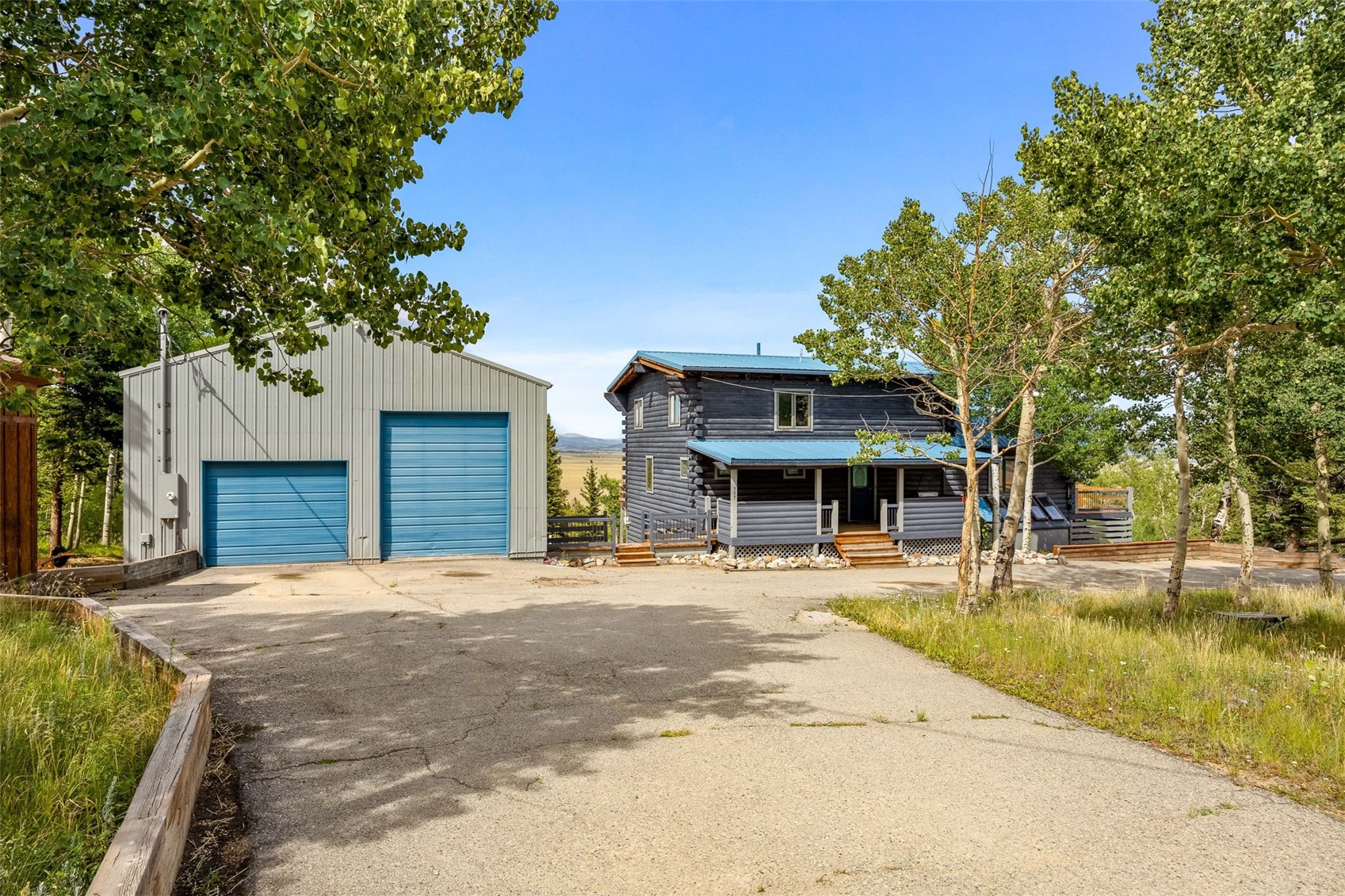 597 Sheep Ridge Road Fairplay, CO 80440 - Photo 1 of 50 a front view of a house with a garden