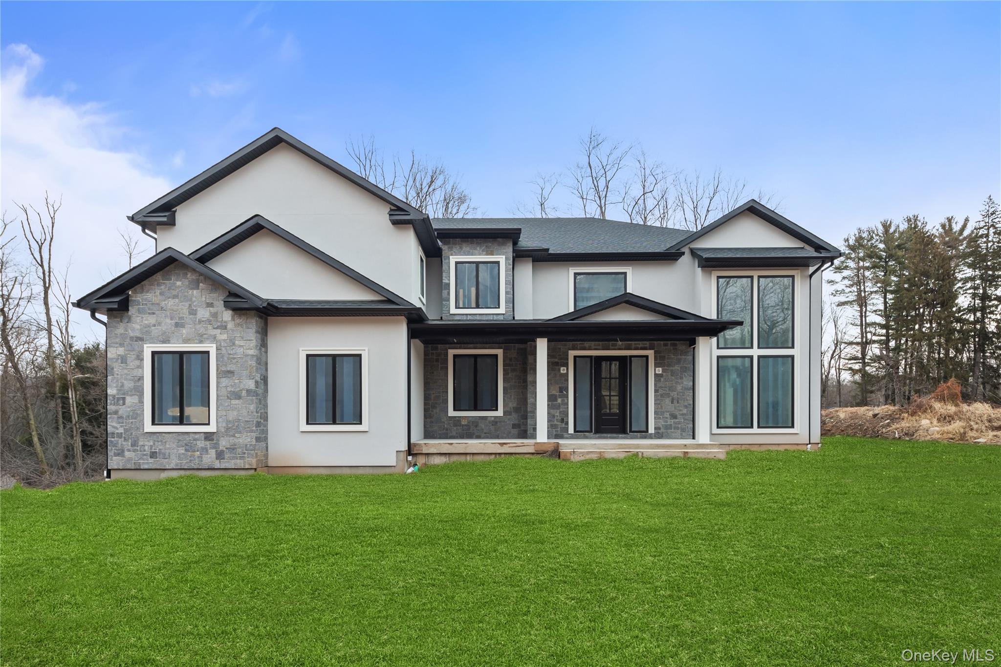 94 Viola Road Suffern, NY 10901 - Photo 1 of 19 a front view of a house with garden