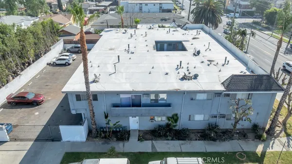an aerial view of a house with a yard
