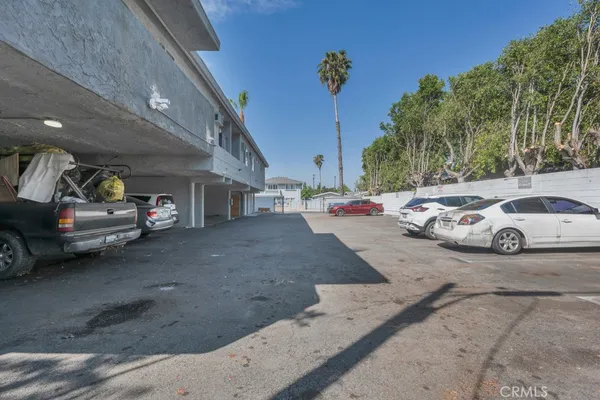 a view of parking area with parked cars