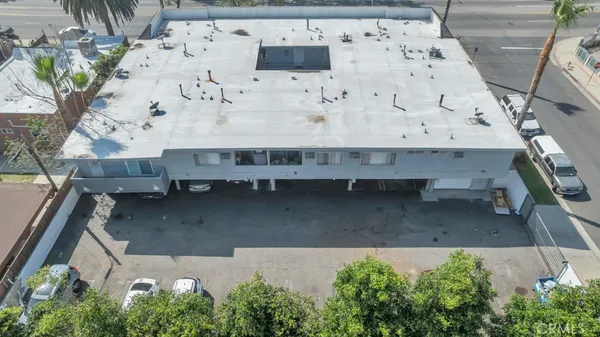 an aerial view of a house with a yard