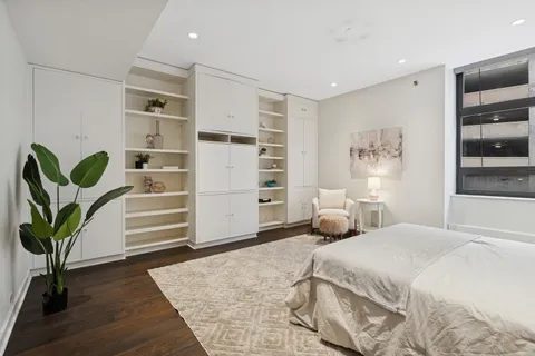 a bedroom with a bed and closet
