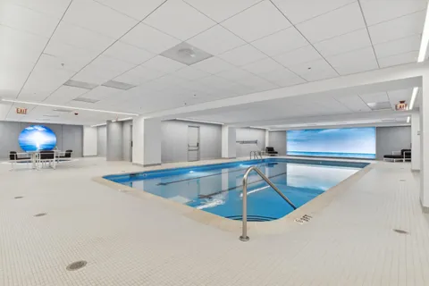 a view of a livingroom with furniture and a ceiling fan