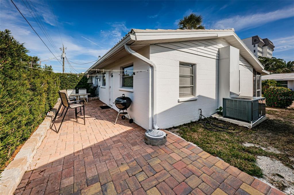 6020 Midnight Pass Road, Unit 14A Sarasota, FL 34242 - Photo 18 of 18 a view of a house with backyard and sitting area