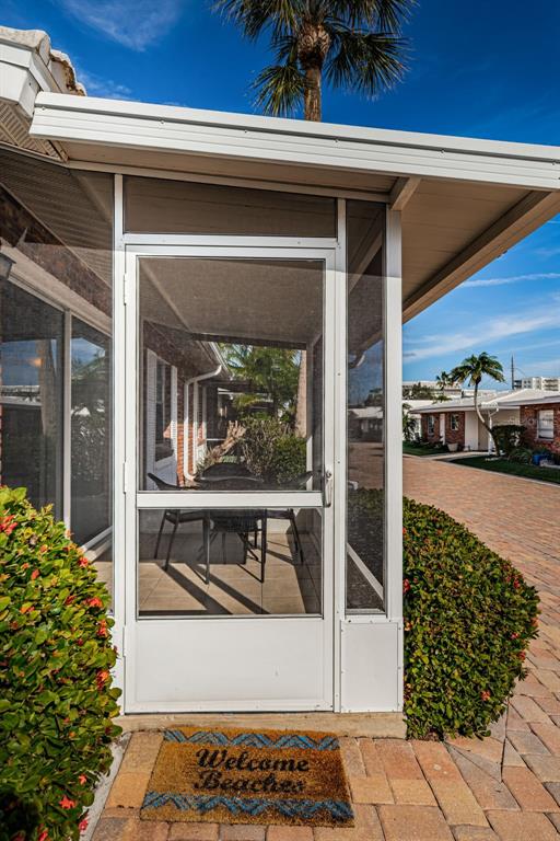 6020 Midnight Pass Road, Unit 14A Sarasota, FL 34242 - Photo 3 of 18 a view of living room and patio