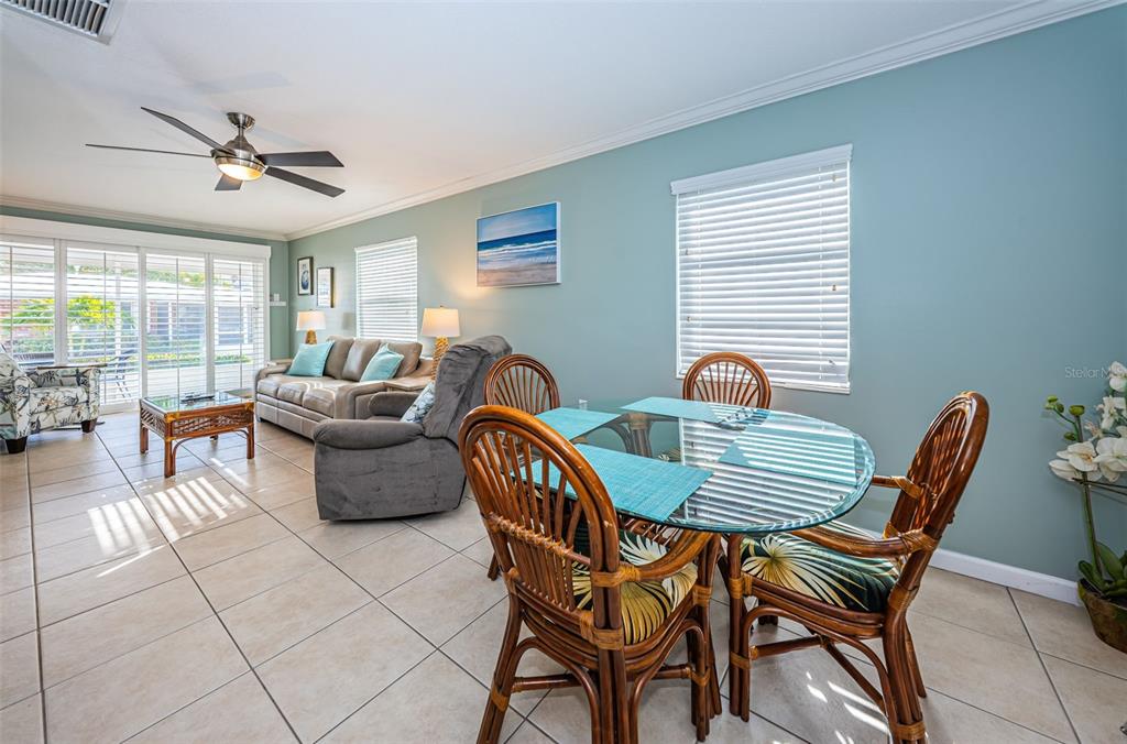 6020 Midnight Pass Road, Unit 14A Sarasota, FL 34242 - Photo 10 of 18 a outdoor living space with furniture and a window