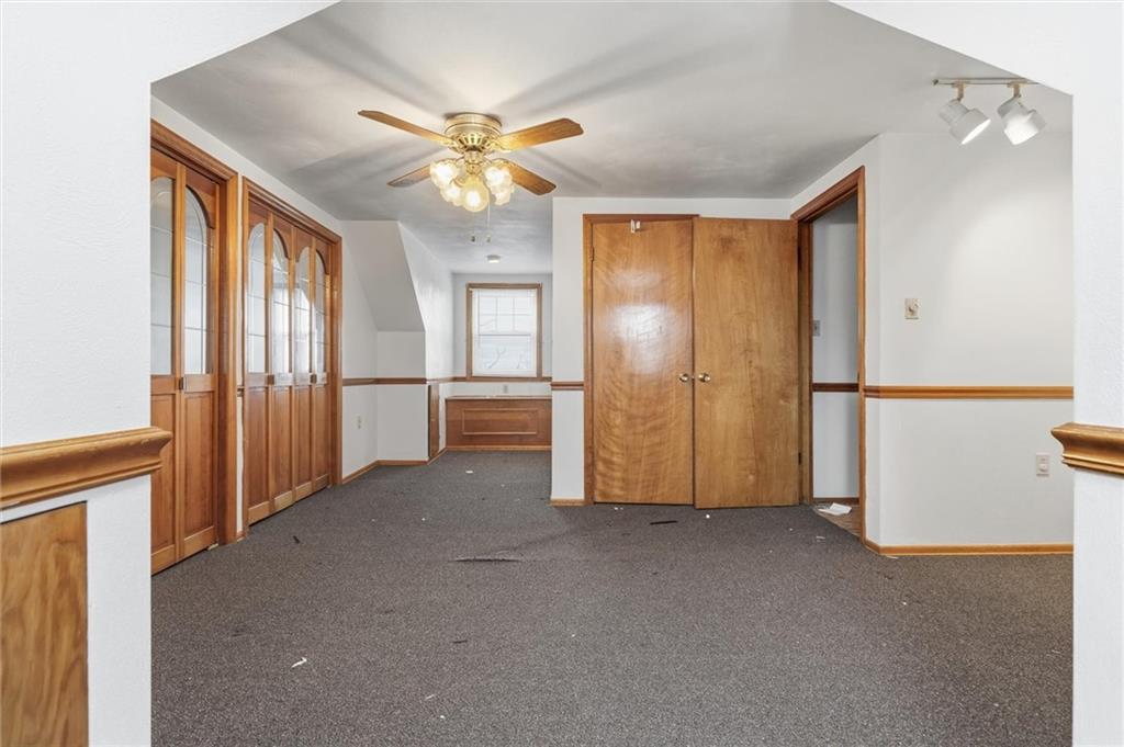 51 Revo Road Pittsburgh, PA 15236 - Photo 11 of 29 an empty room with chandelier fan and windows