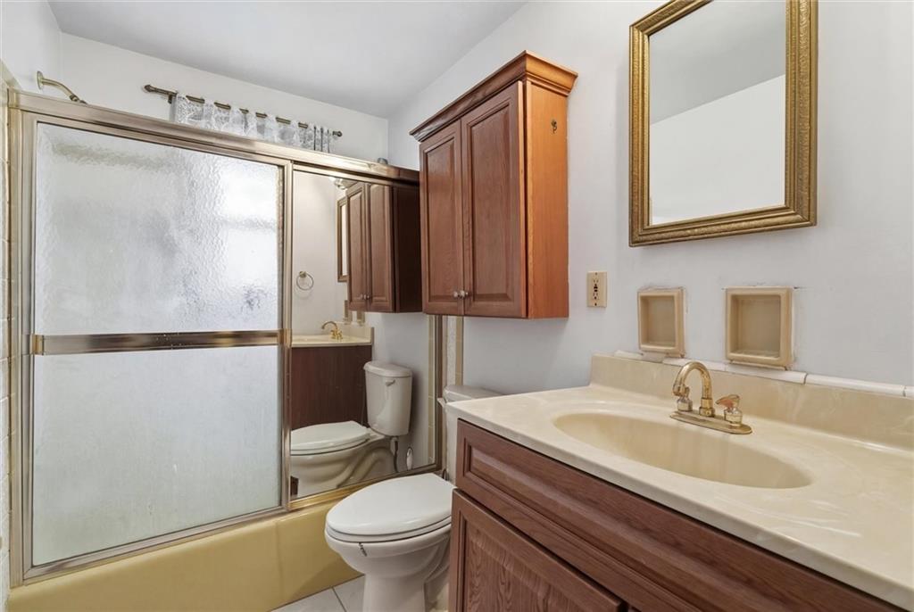 51 Revo Road Pittsburgh, PA 15236 - Photo 19 of 29 a bathroom with a granite countertop sink toilet and shower