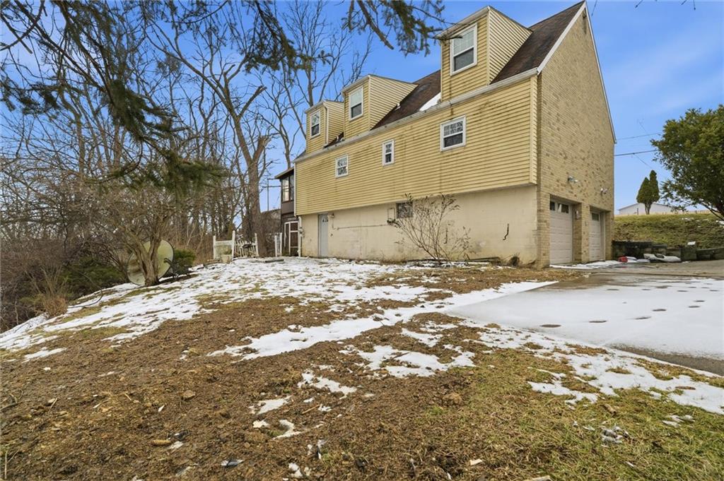 51 Revo Road Pittsburgh, PA 15236 - Photo 28 of 29 a street view with a building