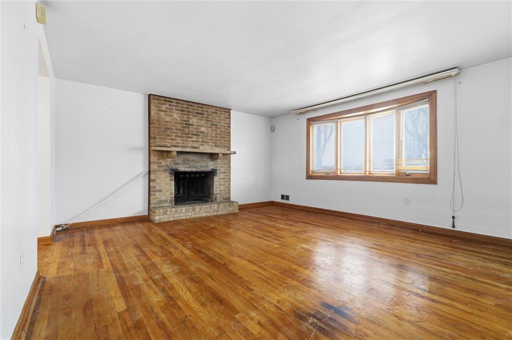 51 Revo Road Pittsburgh, PA 15236 - Photo 4 of 29 a view of an empty room with wooden floor and a window