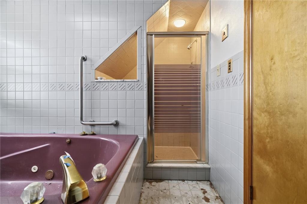 51 Revo Road Pittsburgh, PA 15236 - Photo 7 of 29 a bathroom with a bathtub and a shower