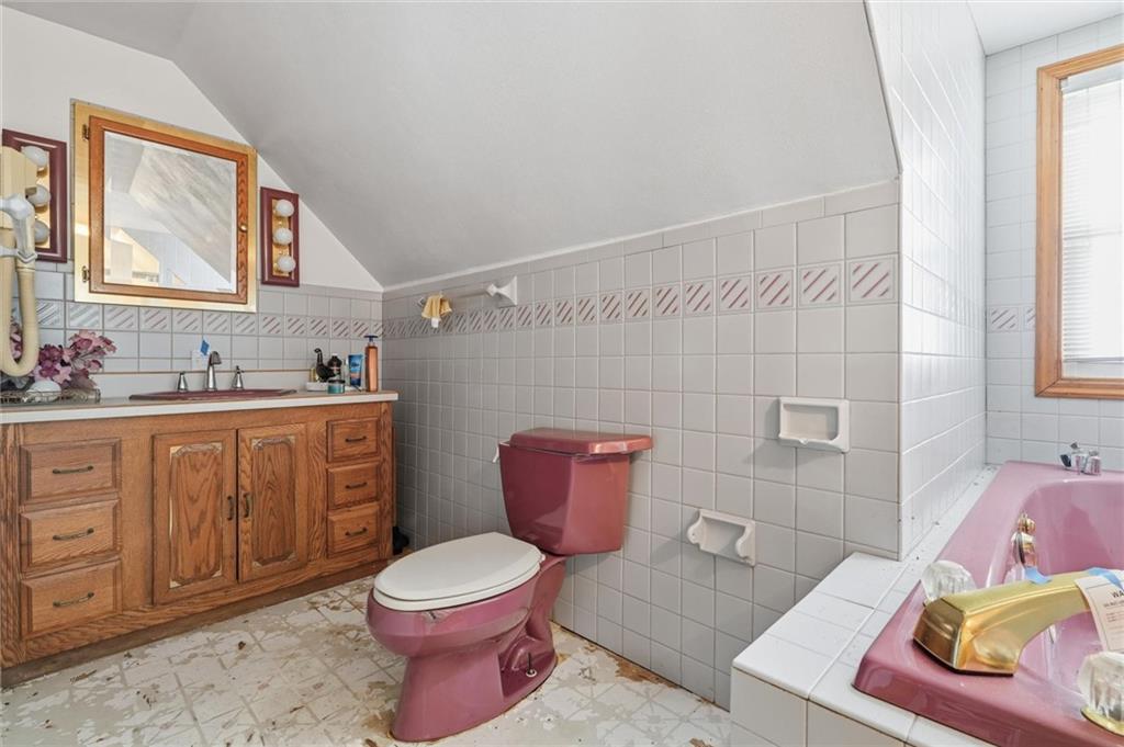 51 Revo Road Pittsburgh, PA 15236 - Photo 8 of 29 a bathroom with a toilet a sink and a mirror