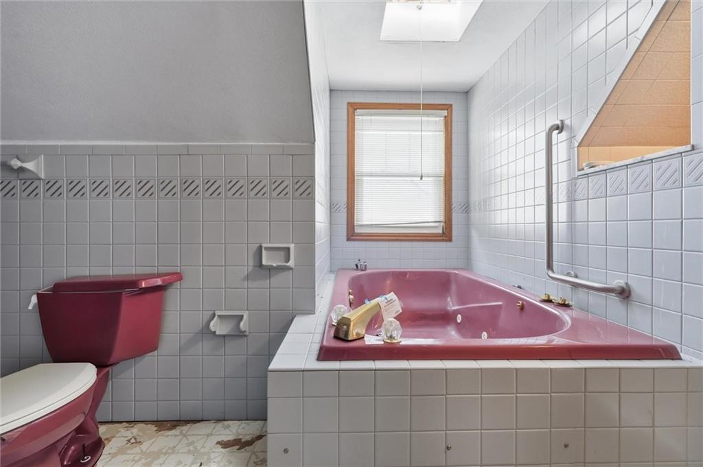 51 Revo Road Pittsburgh, PA 15236 - Photo 9 of 29 a bathroom with a sink toilet vanity and tub