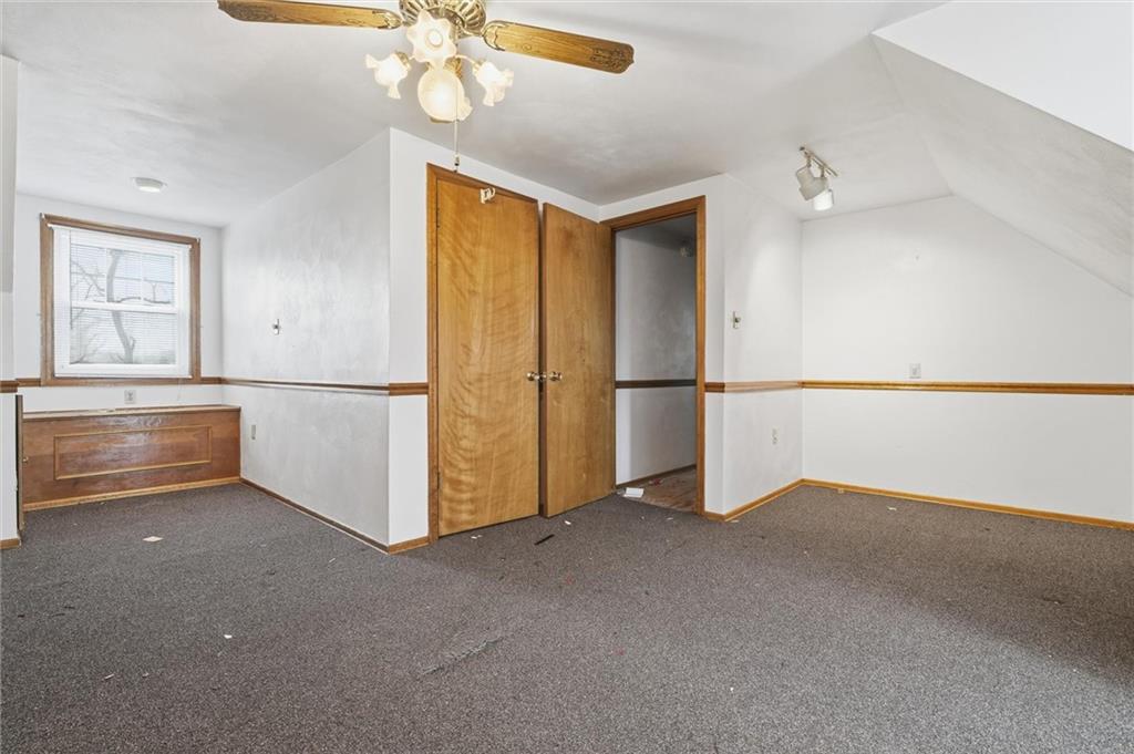 51 Revo Road Pittsburgh, PA 15236 - Photo 10 of 29 an empty room with chandelier fan and windows