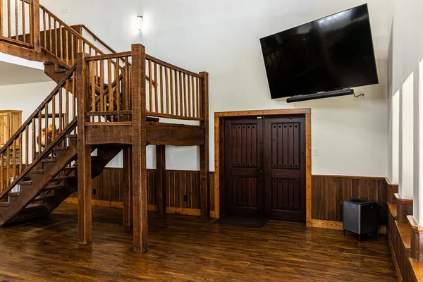 a view of a livingroom with furniture and staircase
