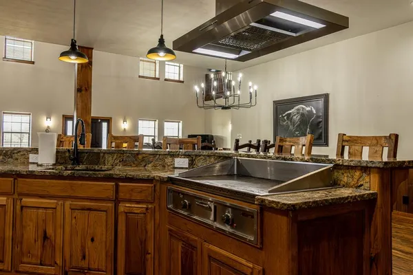 a kitchen with a sink and stove