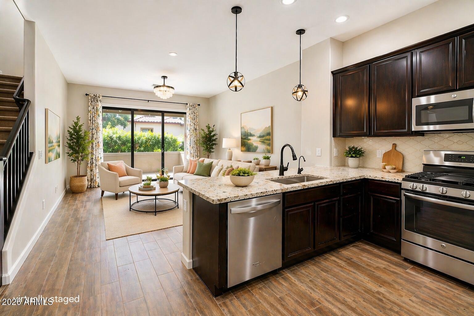 4777 South Fulton Ranch Boulevard, Unit 1123 Chandler, AZ 85248 - Photo 18 of 18 a kitchen with a sink and wooden floor