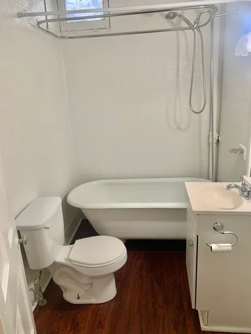 a bathroom with a toilet and a sink