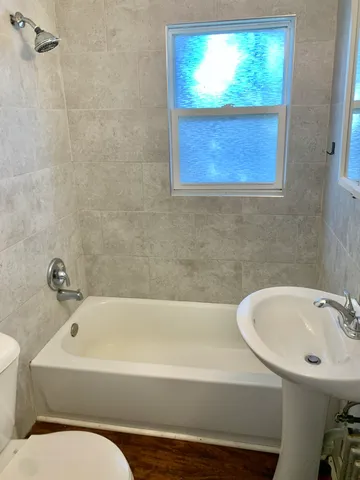 a bathroom with a sink and a bathtub