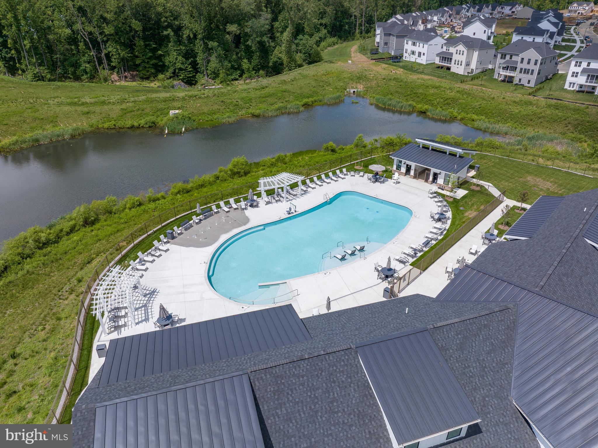 117 Summit Point Boulevard Bowie, MD 20716 - Photo 13 of 20 an aerial view of a house with a lake view