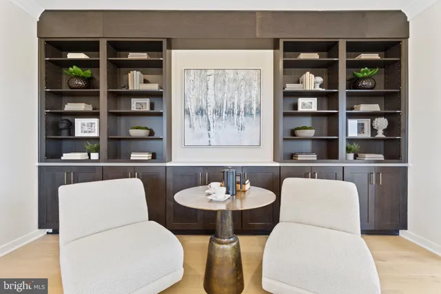 a dining room with furniture and a book shelf