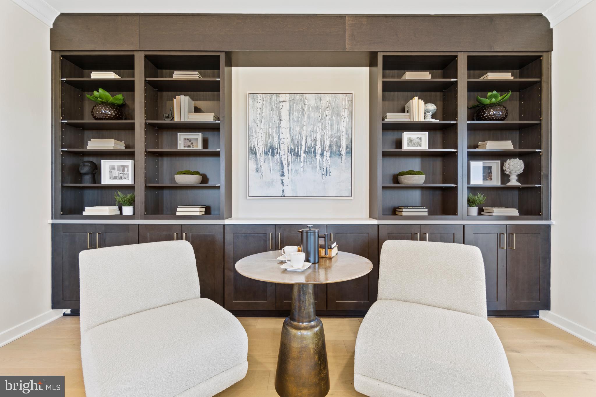 117 Summit Point Boulevard Bowie, MD 20716 - Photo 5 of 20 a dining room with furniture and a book shelf