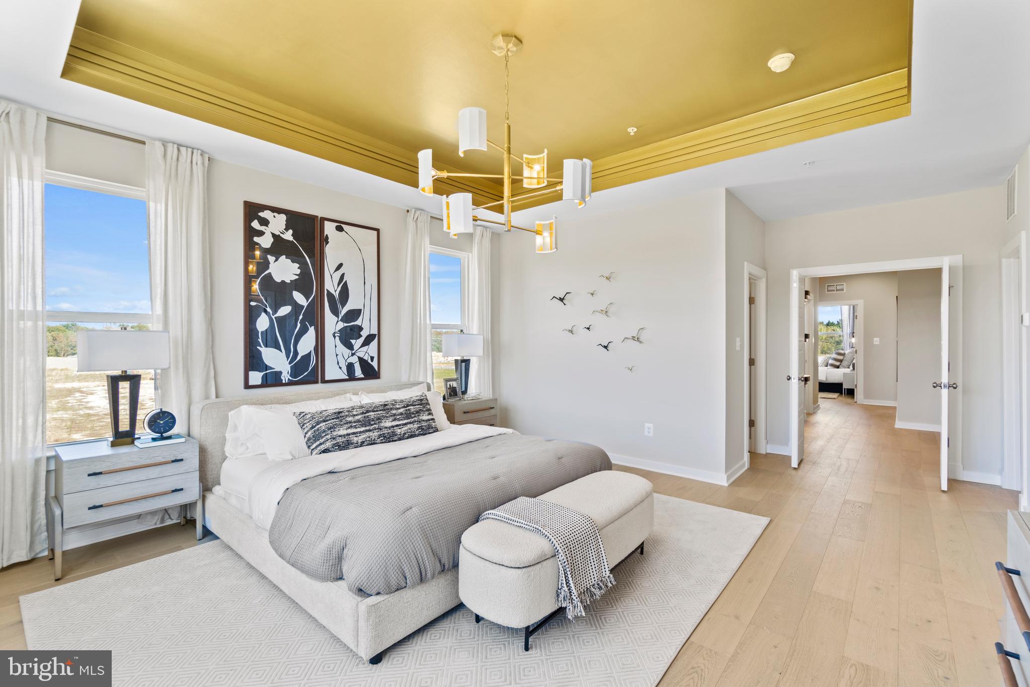 117 Summit Point Boulevard Bowie, MD 20716 - Photo 7 of 20 a bedroom with a bed and a chandelier