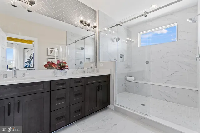a bathroom with a sink double vanity and shower