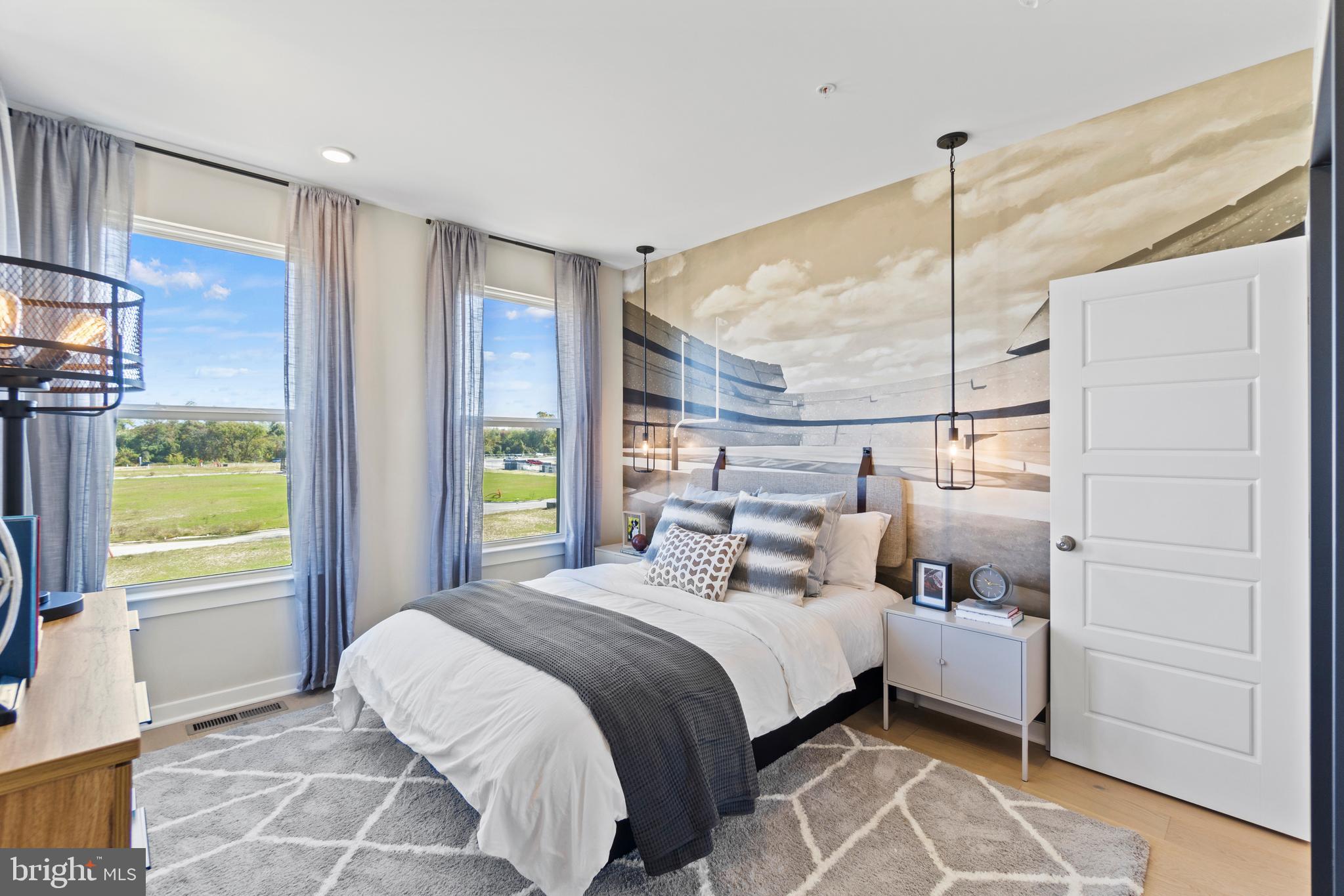 117 Summit Point Boulevard Bowie, MD 20716 - Photo 10 of 20 a bedroom with a bed and a window