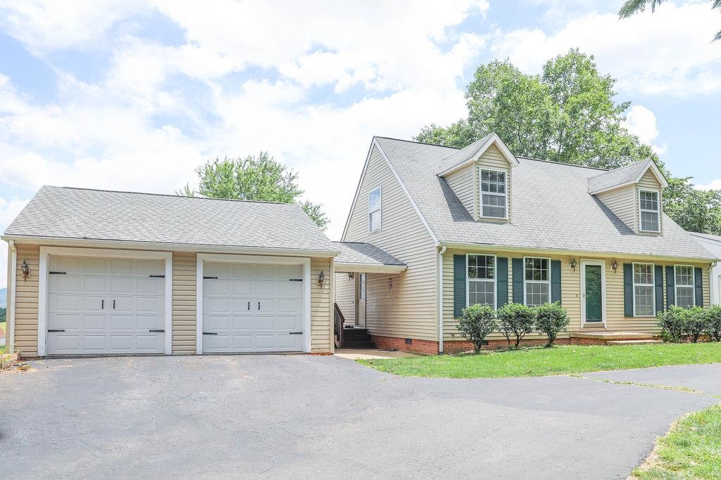 79 Cattle Scales Road Waynesboro, VA 22980 - Photo 1 of 39 front view of a house with a yard and a garage