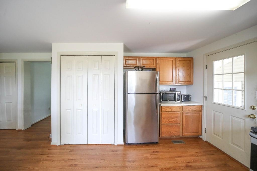 79 Cattle Scales Road Waynesboro, VA 22980 - Photo 14 of 39 a kitchen with stainless steel appliances a refrigerator and a window